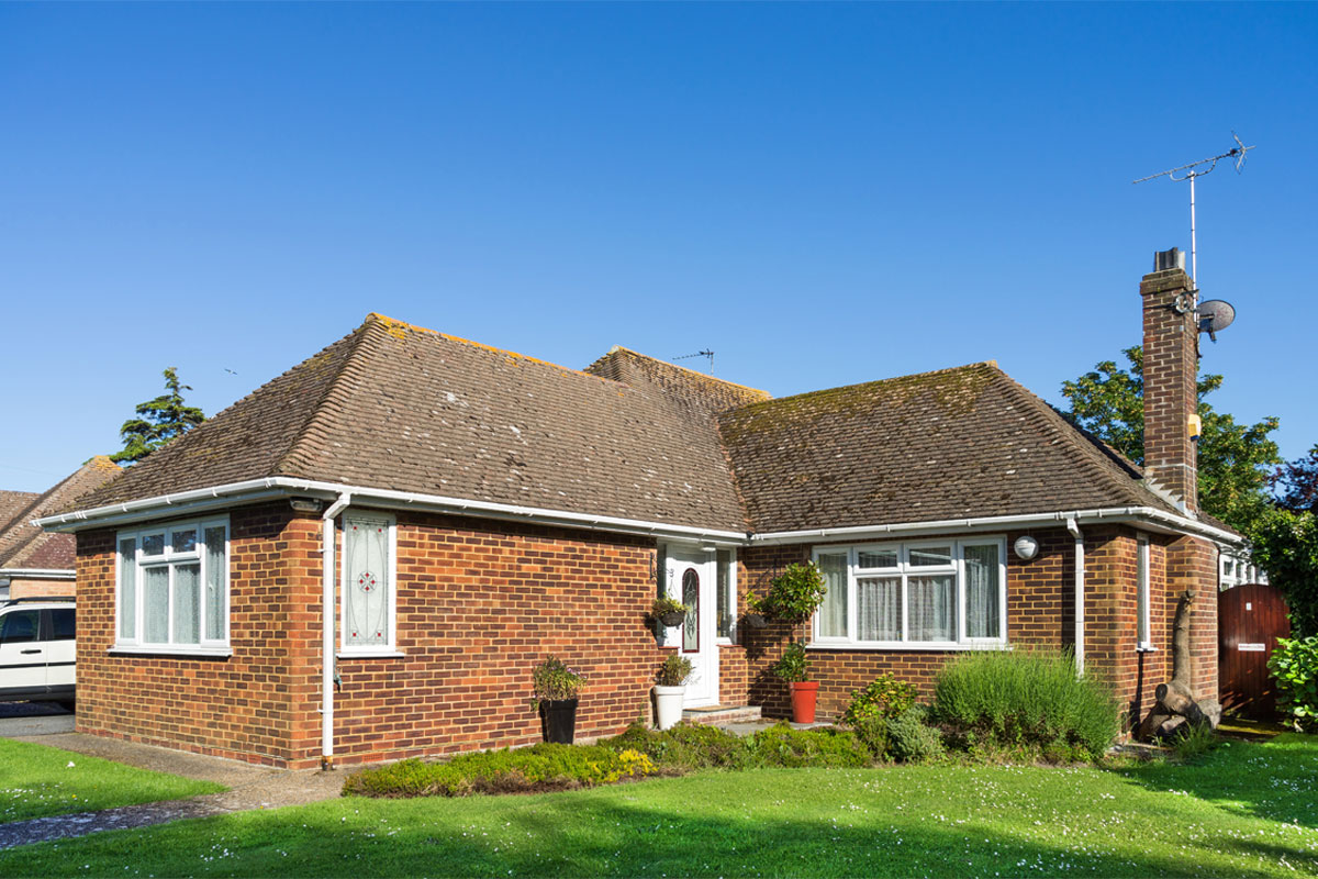 English bungalow property with grass garden